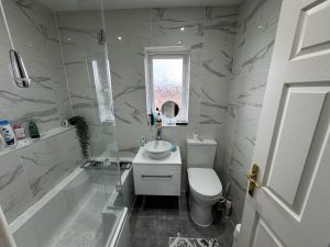 A bathroom with a basin, toilet, and bath—perfect inspiration for your next kitchen and bathroom showroom visit or design installation.