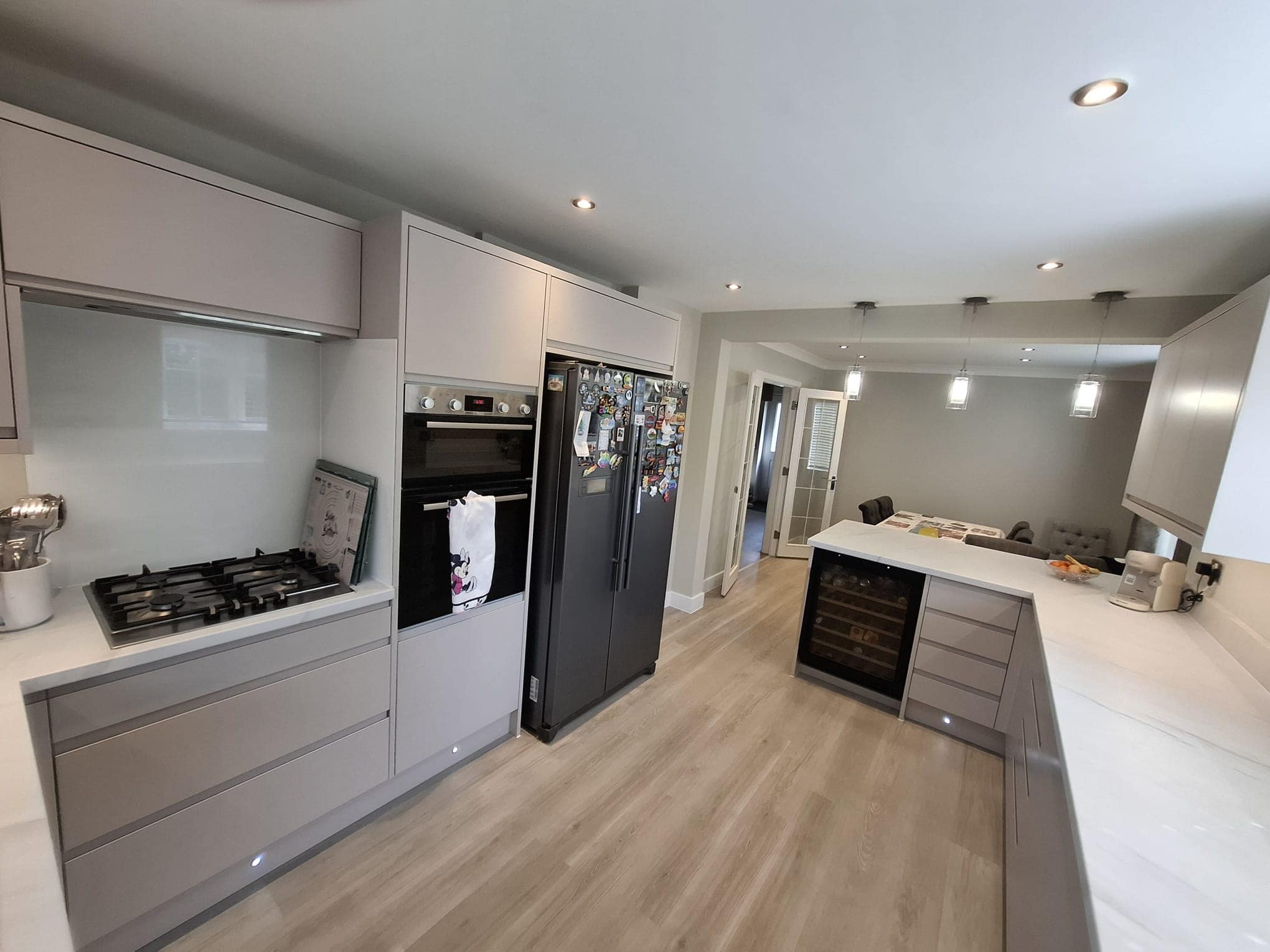 Modern kitchen with light wood flooring
