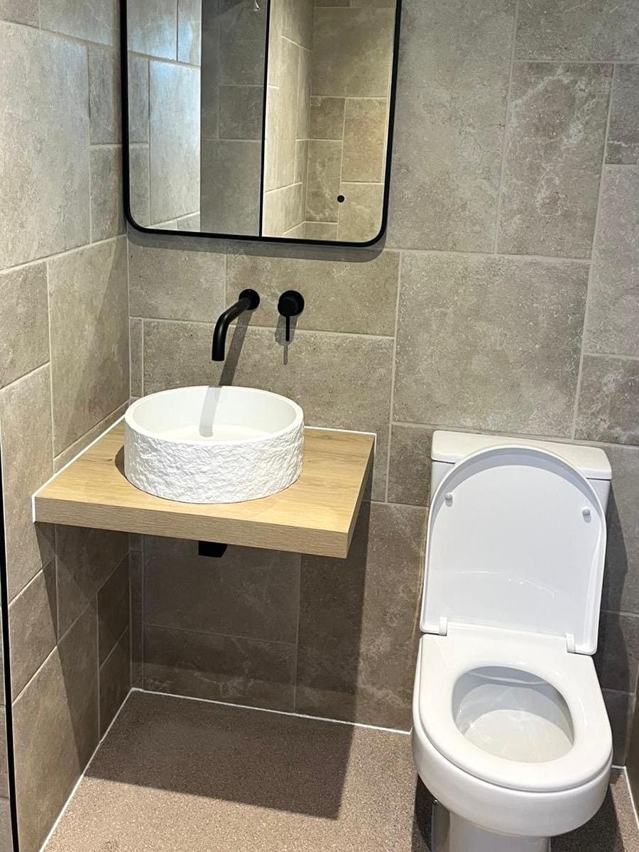 Modern bathroom with beige tiles