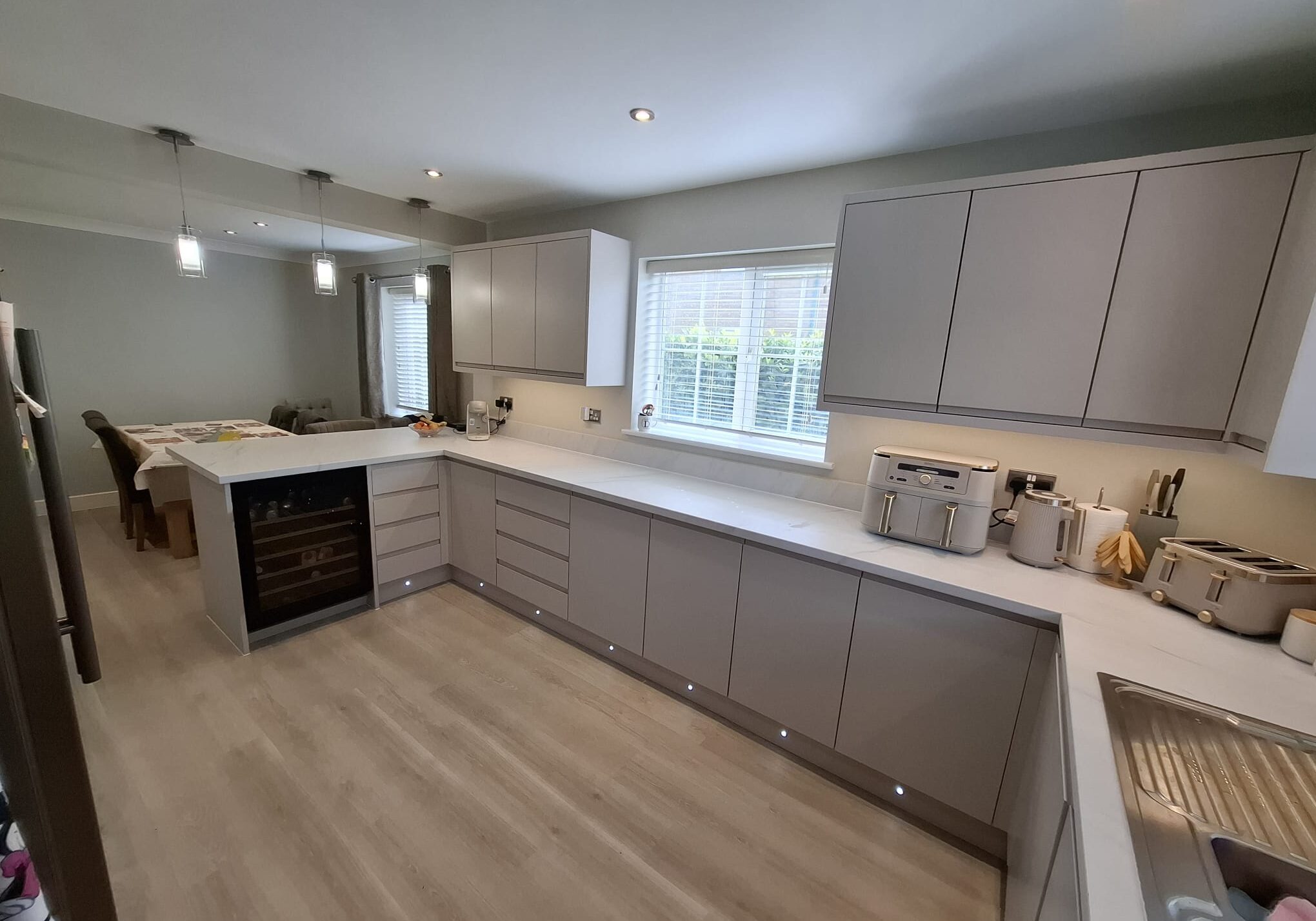 Modern kitchen with light grey cupboards Modern kitchen with light grey cupboards